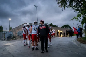 Westside Higih School head coach Paul Limongi leads his team to the field before a game between the Millard South and Omaha Westside in Omaha, NE on Sunday October 13tth, 2023. Photo by Eric Francis