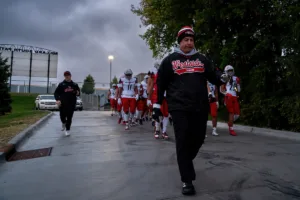 Westside Higih School head coach Paul Limongi leads his team to the field before a game between the Millard South and Omaha Westside in Omaha, NE on Sunday October 13tth, 2023. Photo by Eric Francis