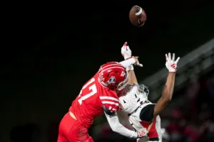 Westside High School quarterback Anthony Rezac (5) has the ball knocked away during a game between the Millard South and Omaha Westside in Omaha, NE on Sunday October 13th, 2023. Photo by Eric Francis