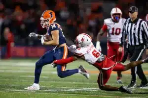 Nebraska Cornhuskers Quinton Newsome (6) tackles Illinois Fighting Illini wide receiver Casey Washington (14) in the first quarter during a college football game in Lincoln, Nebraska, Friday, October 6, 2023. Photo by John Peterson.