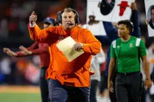 Illinois Fighting Illini head coach Bret Bielema runs along the sideline to call a timeout against the Nebraska Cornhuskers during a college football game in Lincoln, Nebraska, Friday, October 6, 2023. Photo by John Peterson.