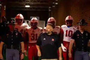 Nebraska Cornhuskers head coach Matt Rhule leads out the team captains before taking on Illinois Fighting Illini during a college football game in Lincoln, Nebraska, Friday, October 6, 2023. Photo by John Peterson.