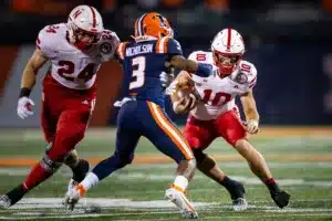 Nebraska Cornhuskers Heinrich Haarberg (10) runs with the ball against Illinois Fighting Illini defensive back Tahveon Nicholson (3) during a college football game in Lincoln, Nebraska, Friday, October 6, 2023. Photo by John Peterson.