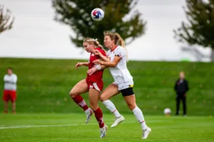 Nebraska Cornhuskers Sarah Weber (42) heads the ball against the Maryland Terrapins in the first half during a college soccer match Thursday, October 12, 2023, in Lincoln, Neb. Photo by John S. Peterson.