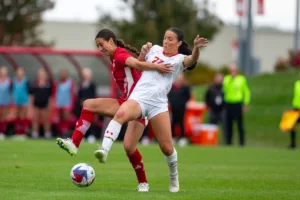 Nebraska Cornhuskers Haley Peterson (2) battles for the ball against Maryland Terrapins forward/midfielder Lisa McIntyre (22) in the first half during a college soccer match Thursday, October 12, 2023, in Lincoln, Neb. Photo by John S. Peterson.
