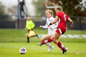 Nebraska Cornhuskers Eleanor Dale (9) makes a goal against Maryland Terrapins defender Katie Coyle (9) in the second half during a college soccer match Thursday, October 12, 2023, in Lincoln, Neb. Photo by John S. Peterson.