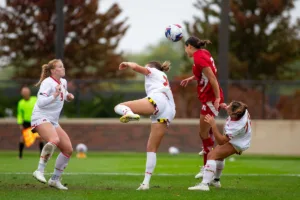 Nebraska Cornhuskers Haley Peterson (2) heads the ball against the Maryland Terrapins in the second half during a college soccer match Thursday, October 12, 2023, in Lincoln, Neb. Photo by John S. Peterson.