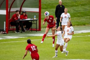 Nebraska Cornhuskers Abbey Schwarz (6) heads the ball against Maryland Terrapins defender Caroline Koutsos (77) in the second half during a college soccer match Thursday, October 12, 2023, in Lincoln, Neb. Photo by John S. Peterson.