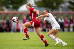 Nebraska Cornhuskers Eleanor Dale (9) attacks against Maryland Terrapins defender Eden White (28) in the second half during a college soccer match Thursday, October 12, 2023, in Lincoln, Neb. Photo by John S. Peterson.