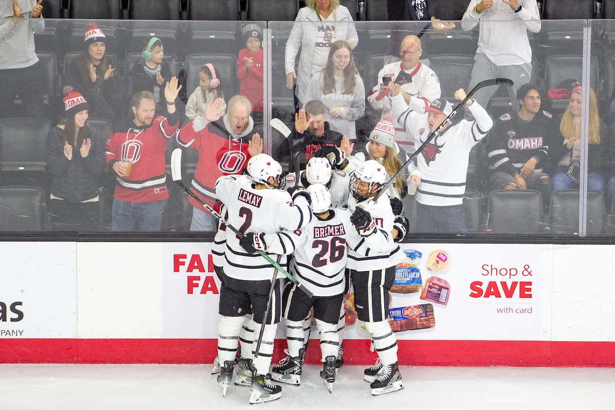 Omaha Mavericks celebrate Zach Urdahl (6) goal in the first period against the Niagara Purple Eagles during a college hockey match on Friday, October 13, 2023, in Omaha, Nebraska. Photo by John S. Peterson.