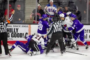 A fight breaks out between the Omaha Mavericks and the Niagara Purple Eagles in the third period during a college hockey match on Friday, October 13, 2023, in Omaha, Nebraska. Photo by John S. Peterson.