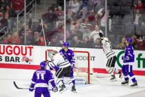 Omaha Mavericks celebrates a goal in the second period against  during a college hockey match on Friday, October 13, 2023, in Omaha, Nebraska. Photo by John S. Peterson.
