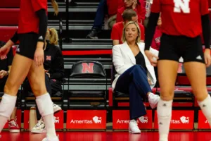 Nebraska Cornhusker assistant coach Jordan Larson watching warm-ups before the taking on Penn St during a college volleyball match on Saturday, October 14, 2023, in Lincoln, Nebraska. Photo by John S. Peterson.