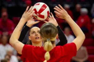 Nebraska Cornhusker Merritt Beason (13) and Lindsay Krause (22) warm-up together before taking on Penn State Nittany Lions during a college volleyball match on Saturday, October 14, 2023, in Lincoln, Nebraska. Photo by John S. Peterson.