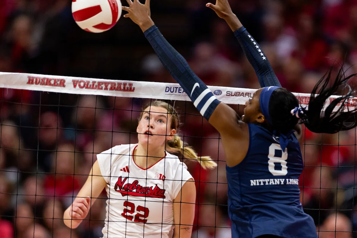 Nebraska Cornhusker Lindsay Krause (22) spikes the ball against Penn State Nittany Lions Camryn Hannah (8) in the first set during a college volleyball match on Saturday, October 14, 2023, in Lincoln, Nebraska. Photo by John S. Peterson.