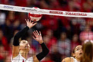 Nebraska Cornhusker Merritt Beason (13) tips the ball against the Penn State Nittany Lions  during a college volleyball match on Saturday, October 14, 2023, in Lincoln, Nebraska. Photo by John S. Peterson.
