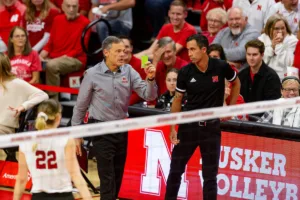 Nebraska Cornhusker head coach John Cook holds up the green challenge card in the first set against the Penn State Nittany Lions during a college volleyball match on Saturday, October 14, 2023, in Lincoln, Nebraska. Photo by John S. Peterson.