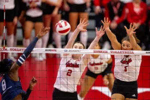 Nebraska Cornhuskers Bergen Reilly (2) and  Bekka Allick (5) attempt a block against Penn State Nittany Lions Camryn Hannah (8) in the first set during a college volleyball match on Saturday, October 14, 2023, in Lincoln, Nebraska. Photo by John S. Peterson.