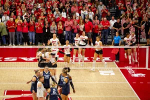 Nebraska Cornhusker celebrate sweeping the Penn State Nittany Lions during a college volleyball match on Saturday, October 14, 2023, in Lincoln, Nebraska. Photo by John S. Peterson.