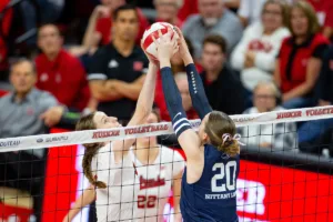 Nebraska Cornhusker Bergen Reilly (2) battles at the net against Penn State Nittany Lions Allie Holland (20) in the third set during a college volleyball match on Saturday, October 14, 2023, in Lincoln, Nebraska. Photo by John S. Peterson.