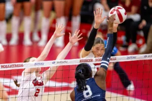 Nebraska Cornhuskers Andi Jackson (15) and Bergen Reilly (2) jump to block a shot from Penn State Nittany Lions Camryn Hannah (8) in the third set during a college volleyball match on Saturday, October 14, 2023, in Lincoln, Nebraska. Photo by John S. Peterson.