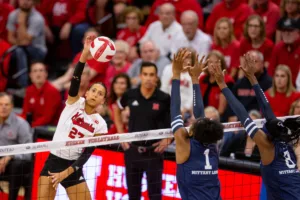 Nebraska Cornhusker Harper Murray (27) spikes the ball agianst Penn State Nittany Lions Taylor Trammell (1) and  Camryn Hannah (8) in the third set during a college volleyball match on Saturday, October 14, 2023, in Lincoln, Nebraska. Photo by John S. Peterson.