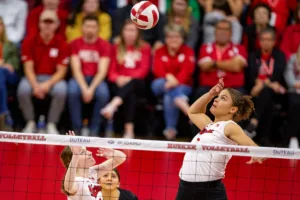 Nebraska Cornhusker Bekka Allick (5) spikes the ball with the set from Bergen Reilly (2) in the third set against the Penn State Nittany Lions during a college volleyball match on Saturday, October 14, 2023, in Lincoln, Nebraska. Photo by John S. Peterson.