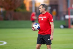 Nebraska Cornhuskers assistant coach Marty  Everding watching warm-ups before taking on the Purdue Boilermakers during a college soccer game on Thursday, October 19, 2023, in Lincoln, Nebraska. Photo by John S. Peterson.