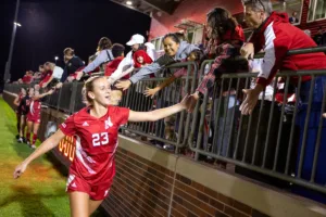 Nebraska Cornhuskers Gwen Lane (23) gives five to the fans after beating Purdue Boilermakers during a college soccer game on Thursday, October 19, 2023, in Lincoln, Nebraska. Photo by John S. Peterson.