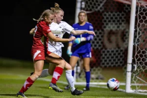 Nebraska Cornhuskers Eleanor Dale (9) battles for the ball against the Purdue Boilermakers in the first half during a college soccer game on Thursday, October 19, 2023, in Lincoln, Nebraska. Photo by John S. Peterson.