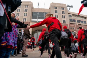 Nebraska Cornhuskers fans show up to welcome the team to the stadium before their game against the Iowa Hawkeyes a game in Lincoln, NE November 24th 2023. Photo by Eric Francis