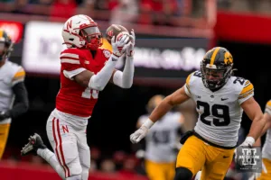 Nebraska Cornhuskers wide receiver Jaylen Lloyd (19 catches a touchdown pass over Iowa Hawkeyes defensive back Sebastian Castro (29) during a game in Lincoln, NE November 24th 2023. Photo by Eric Francis