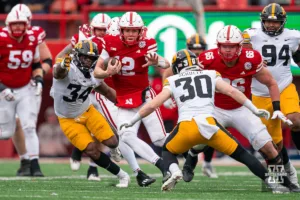 Nebraska Cornhuskers quarterback Chubba Purdy (12) runs for a first down during a against the Iowa Hawkeyes game in Lincoln, NE November 24th 2023. Photo by Eric Francis