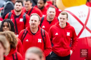 Nebraska Cornhusker offfensive coordinator Marcus Satterfield makes his way to the stadium in the Unity Walk before taking on the Maryland Terrapins during a football game on Saturday, November 11, 2023, in Lincoln, Nebraska. Photo by John S. Peterson.