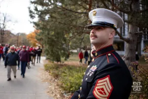 A Marine collect for Toys for Tots before the football game against the Maryland Terrapins on Saturday, November 11, 2023, in Lincoln, Nebraska. Photo by John S. Peterson.