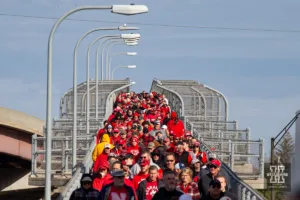 Nebraska Cornhusker fans make their way to the stadium before the football game against the Maryland Terrapins on Saturday, November 11, 2023, in Lincoln, Nebraska. Photo by John S. Peterson.