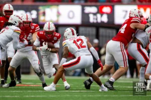 Nebraska Cornhusker wide receiver Joshua Fleeks (11) runs with the ball against Maryland Terrapin defensive back Dante Trader Jr. (12) in the second quarter during the football game on Saturday, November 11, 2023, in Lincoln, Nebraska. Photo by John S. Peterson.