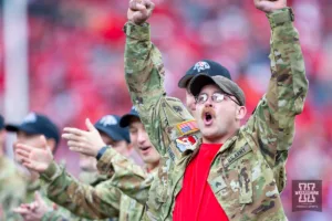 The flight crem of the Army Guard CH-47 Chinook helicopters from Grand Island is introduced at a break in the action against the Maryland Terrapins during the football game on Saturday, November 11, 2023, in Lincoln, Nebraska. Photo by John S. Peterson.