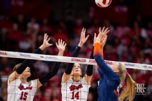 Nebraska Cornhuskers Andi Jackson (15) and Ally Batenhorst (14) jump up to block Illinois Fighting Illini Cari Bohm (11) in the first set during the volleyball match on Sunday, November 12, 2023, in Lincoln, Nebraska. Photo by John S. Peterson.