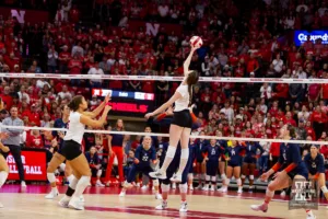 Nebraska Cornhusker Bergen Reilly (2) reaches to tip the ball against the Illinois Fighting Illini in the third set during the volleyball match on Sunday, November 12, 2023, in Lincoln, Nebraska. Photo by John S. Peterson.
