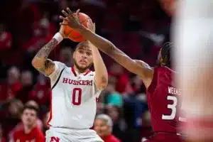 Nebraska Cornhusker guard C.J. Wilcher (0) looks to pass against Rider Bronc Tyrieks Weeks in the second half during the basketball game on Monday, November 13, 2023, in Lincoln, Nebraska. Photo by John S. Peterson.