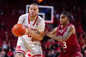 Nebraska Cornhusker guard C.J. Wilcher (0) looks to pass against Rider Bronc guard Corey McKeithan (3) in the second half during the basketball game on Monday, November 13, 2023, in Lincoln, Nebraska. Photo by John S. Peterson.