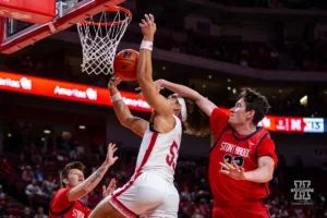 Nebraska Cornhusker forward Josiah Allick (53) is fouled by Stony Brook Seawolf center Keenan Fitzmorris (32) going for a layup in the first half during the basketball game on Wednesday, November 15, 2023, in Lincoln, Nebraska. Photo by John S. Peterson.