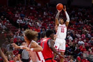 Nebraska Cornhusker guard Jamarques Lawrence (10) makes three point against the Stony Brook Seawolves  during the basketball game on Wednesday, November 15, 2023, in Lincoln, Nebraska. Photo by John S. Peterson.