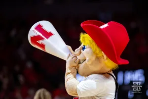 Nebraska Cornhusker mascot Herbie Husker cheeer at a break in the action against the Stony Brook Seawolves in the first half during the basketball game on Wednesday, November 15, 2023, in Lincoln, Nebraska. Photo by John S. Peterson.