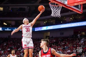 Nebraska Cornhusker guard Keisei Tominaga (30) makes a layup against the Stony Brook Seawolves in the second half during the basketball game on Wednesday, November 15, 2023, in Lincoln, Nebraska. Photo by John S. Peterson.