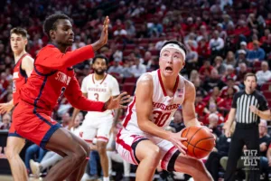 Nebraska Cornhusker guard Keisei Tominaga (30) drives to the basket against Stony Brook Seawolf guard Toby Onyekonwu (3) in the second half during the basketball game on Wednesday, November 15, 2023, in Lincoln, Nebraska. Photo by John S. Peterson.