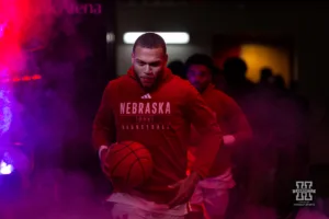 Nebraska Cornhusker guard C.J. Wilcher (0) leads the Huskers out against the Stony Brook Seawolves during the basketball game on Wednesday, November 15, 2023, in Lincoln, Nebraska. Photo by John S. Peterson.