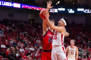 Nebraska Cornhusker guard Keisei Tominaga (30) drives to the basket against Stony Brook Seawolf guard Jared Frey (24) in the first half during the basketball game on Wednesday, November 15, 2023, in Lincoln, Nebraska. Photo by John S. Peterson.