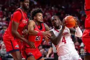 Nebraska Cornhusker forward Juwan Gary (4) drives to the basket against Stony Brook Seawolf guard Andre Snoddy (21) and forward Chris Maidoh (4) in the first half during the basketball game on Wednesday, November 15, 2023, in Lincoln, Nebraska. Photo by John S. Peterson.